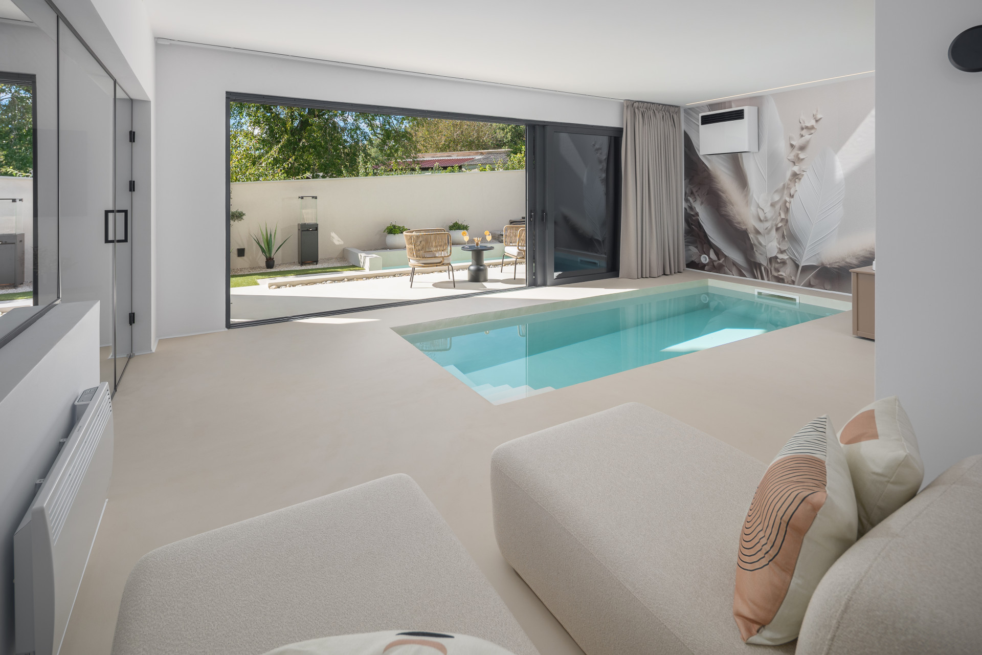 Modern luxury villa Amoreta interior with private indoor pool, minimalist design, and open terrace for a romantic couples getaway