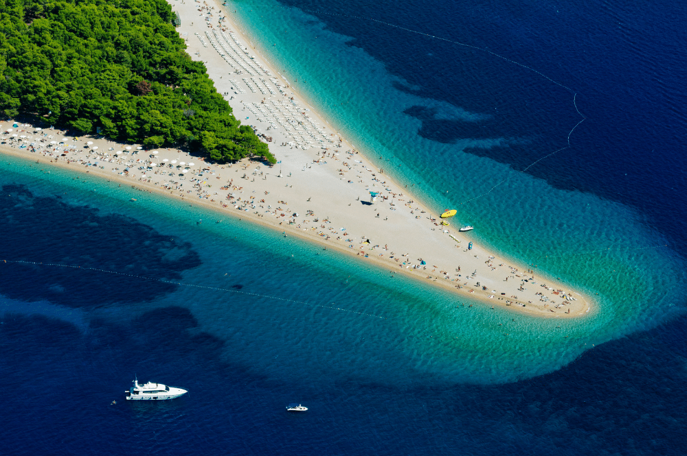 relaxing on the zlatni rat (golden cape) beach