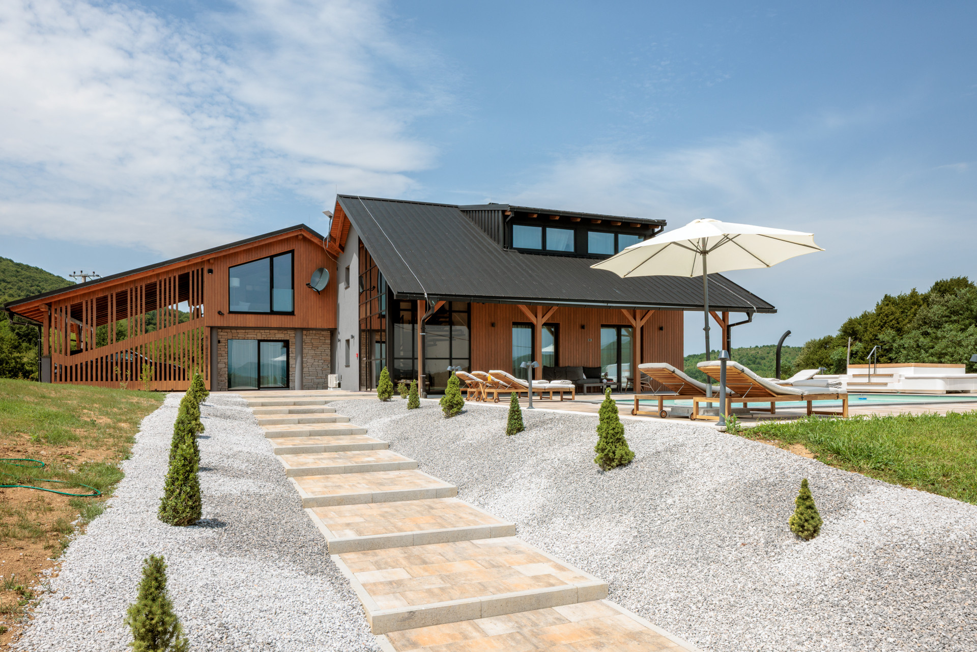 Villa Josephine by Vidrovaca with private pool, sun loungers and modern wooden exterior surrounded by nature in Croatia.