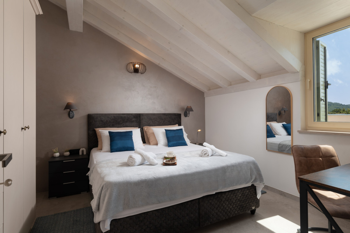 Sophisticated attic bedroom at Villa Utopia