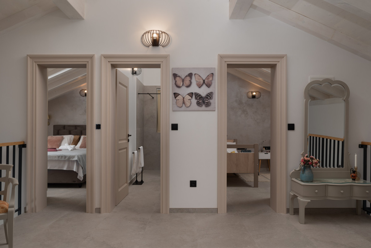 Modern Attic Hallway with Three Interior Doors