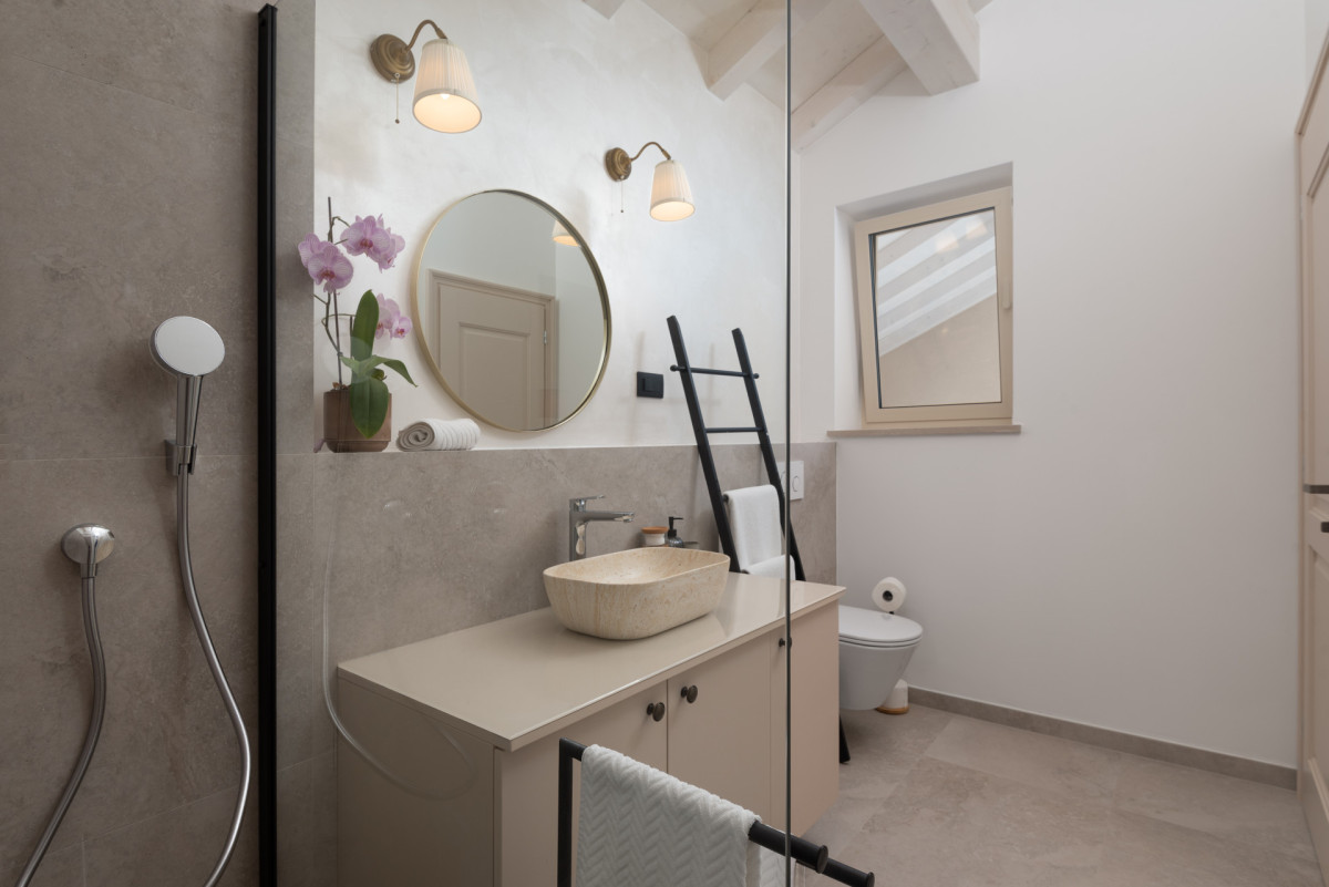 Elegant Attic Bathroom with Stone Vessel Sink