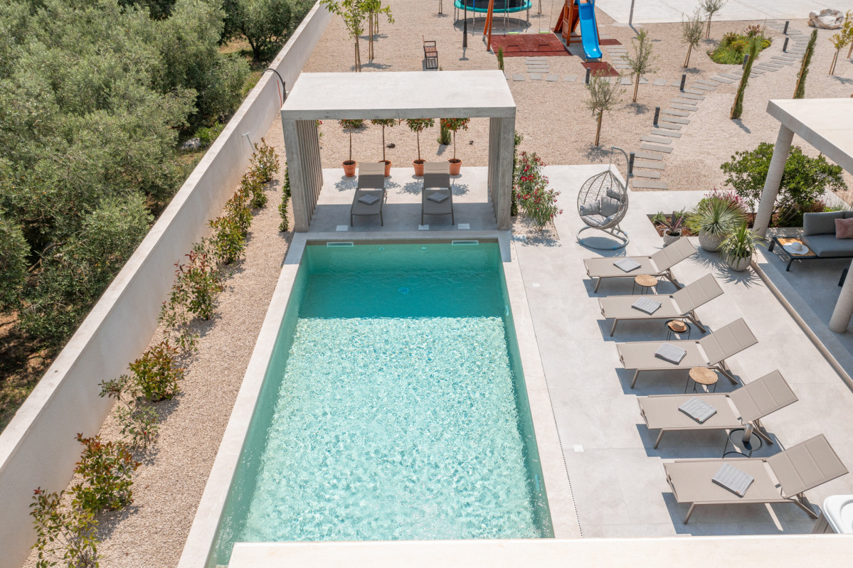 Sophisticated poolside lounging at Villa Utopia's private oasis
