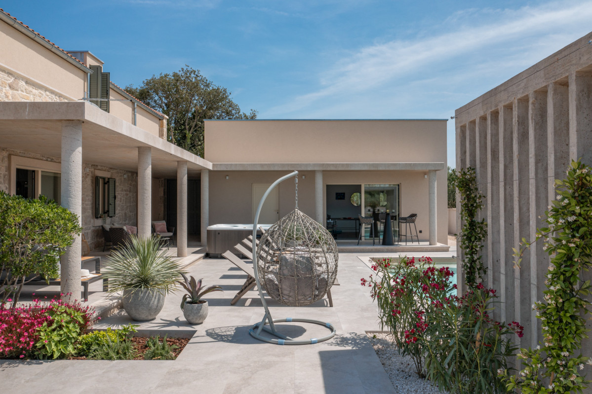 Luxury Villa Courtyard with Pool, Jacuzzi, and Lounge Area
